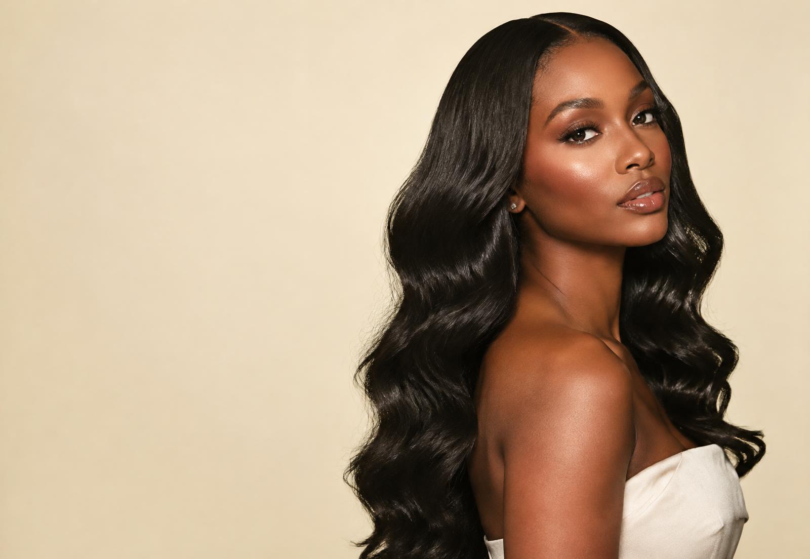 Model wearing a long body-wave wig